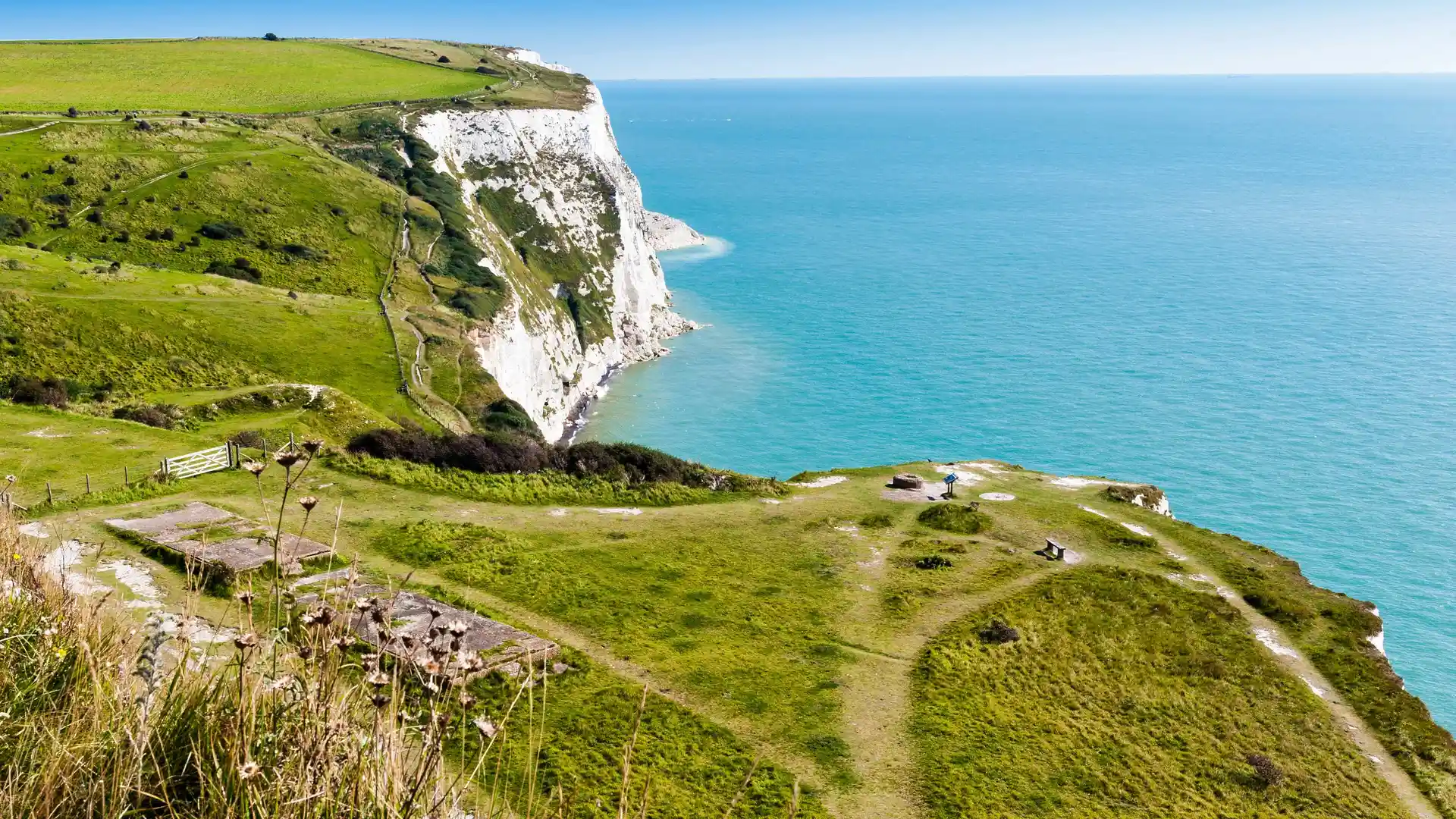 White chalk cliffs above the sea on the England Coast Path near Dover.
