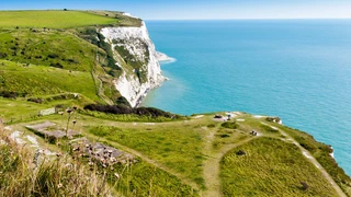 White chalk cliffs above the sea on the England Coast Path near Dover.