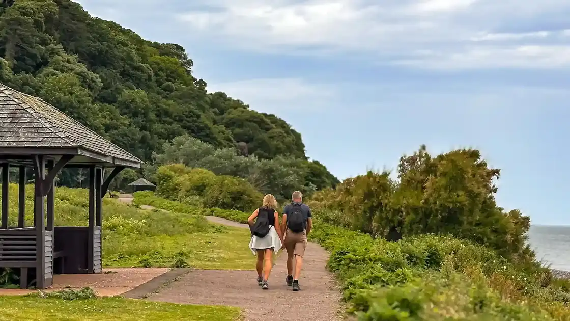 Walkers leaving Minehead at the start of the South West Coast Path in Somerset.