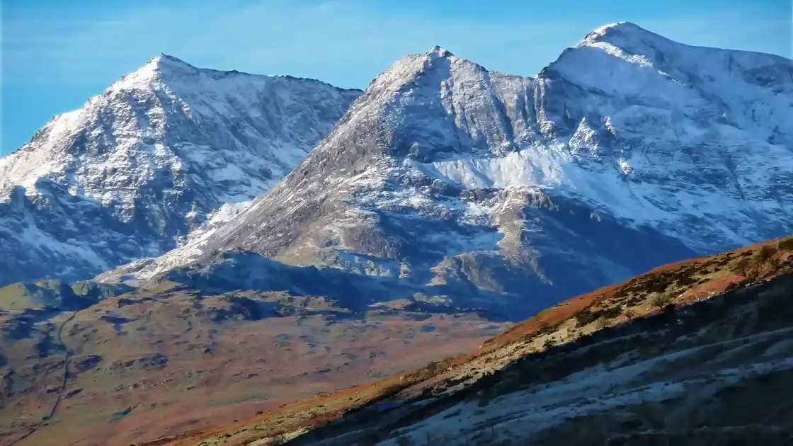 Snow-covered peaks of the Snowdon Horseshoe in Eryri National Park, Wales.