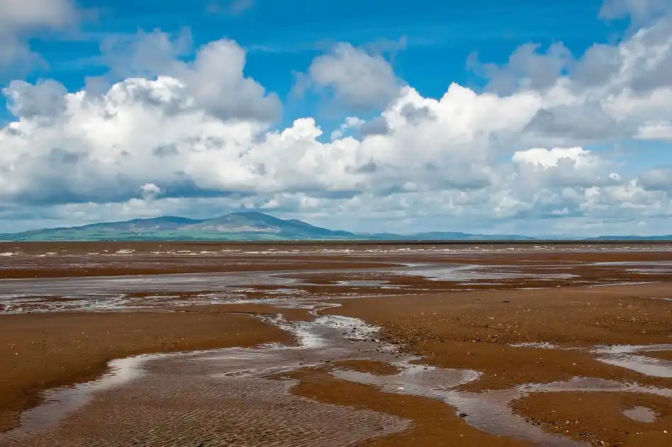 View across the sandstone beach of Solway Firth in Cumbria