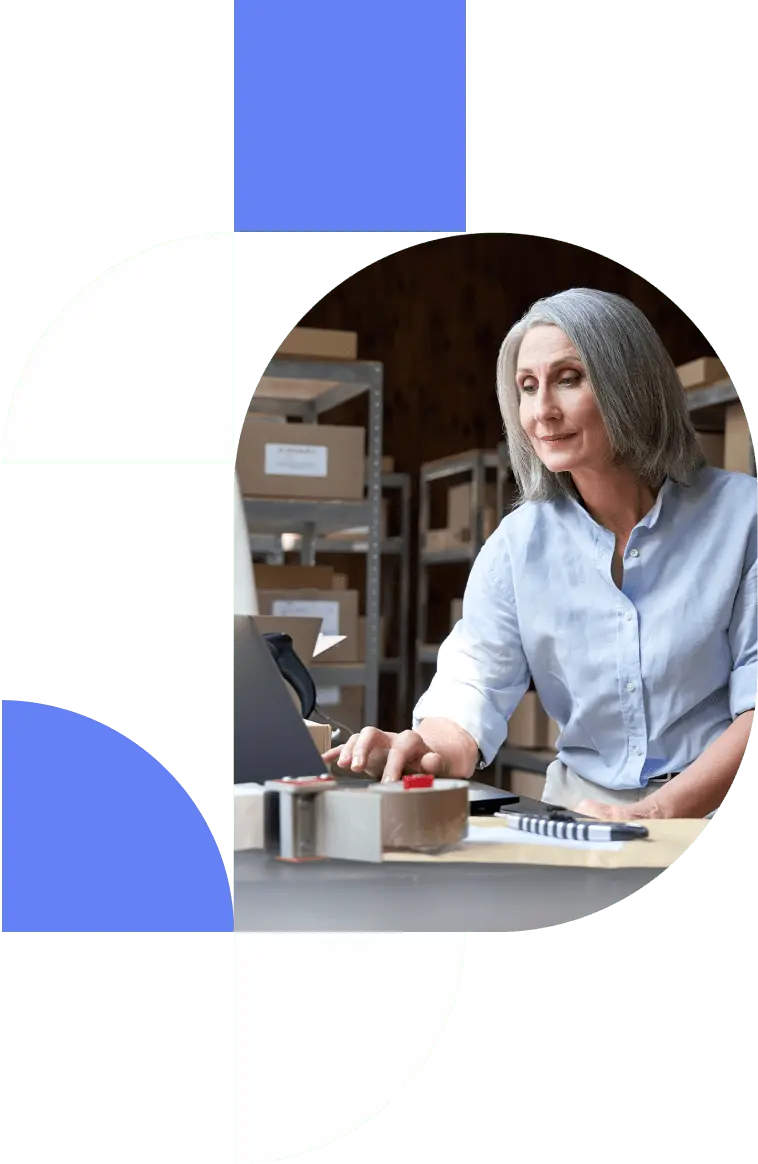 Business merchant processing shipping orders in her warehouse