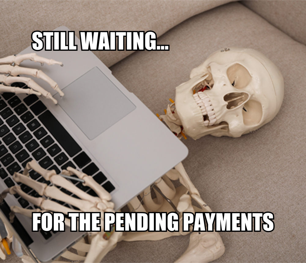 Skeleton lying on a couch with a laptop, humorously illustrating the frustration of waiting for overdue freelance payments.