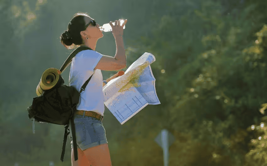 a traveler is drinking water