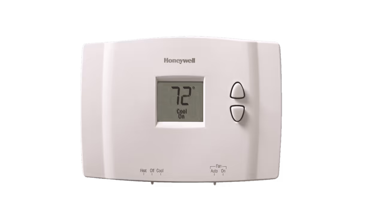 Honeywell digital thermostat displaying 72 degrees Fahrenheit with cool mode on and up/down buttons on the right.