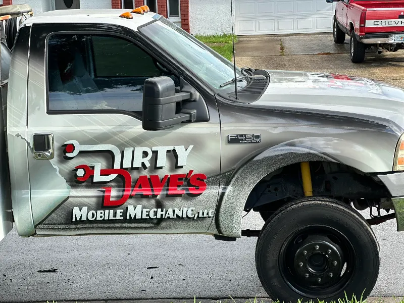 Ford F-450 truck for mobile mechanic service with “Dirty Dave’s” branding and visible suspension components.