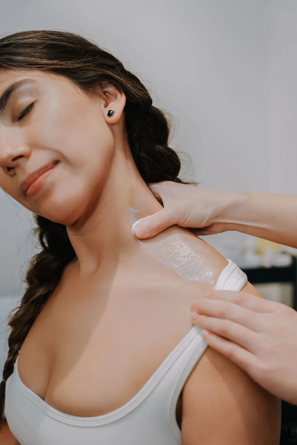 Physiotherapist performing soft tissue release to the neck after a car accident