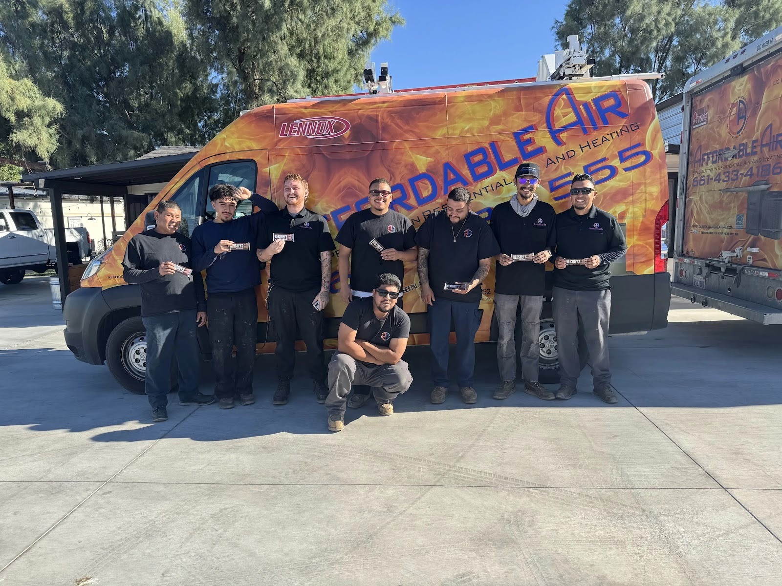 Close-up of air conditioning unit components, including filter, coils, and blower assembly, during a tune-up