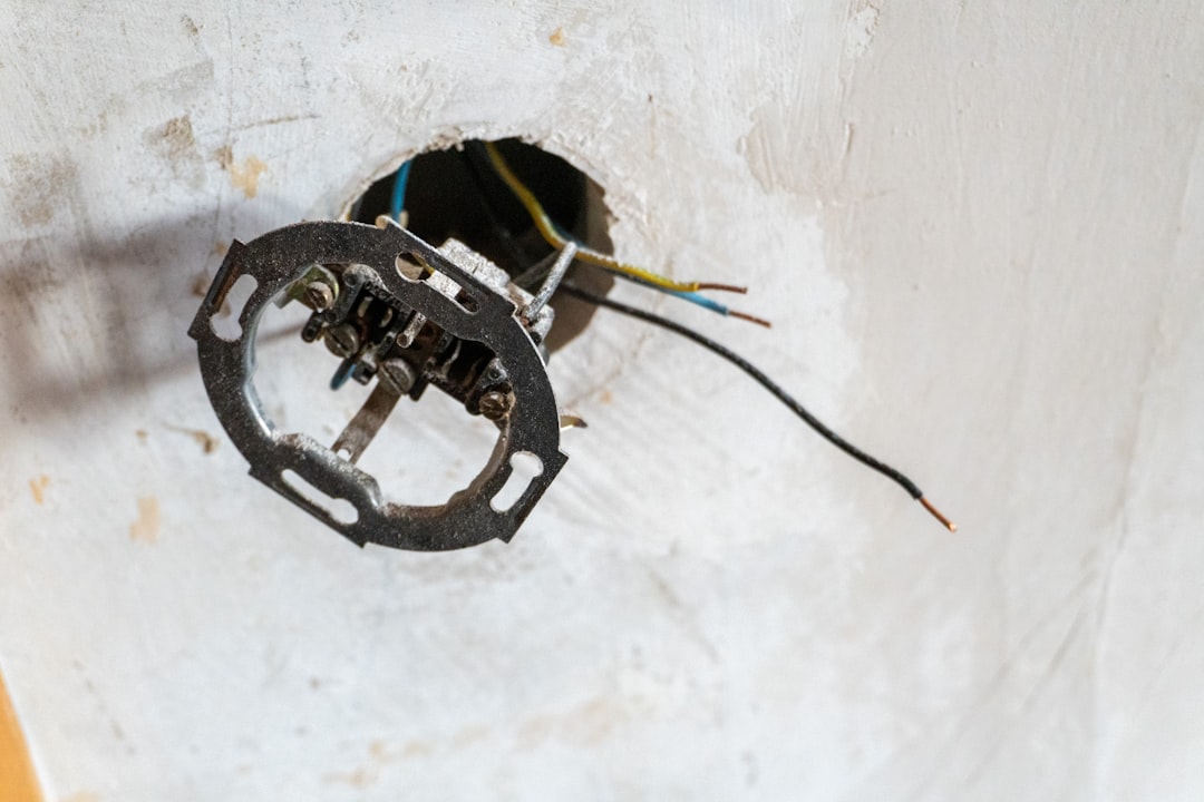 Burnt electrical contacts on a failing AC contactor