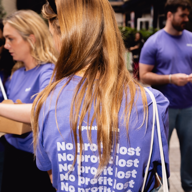 Team member wearing Nory's No Profit Lost t-shirt at a company gathering