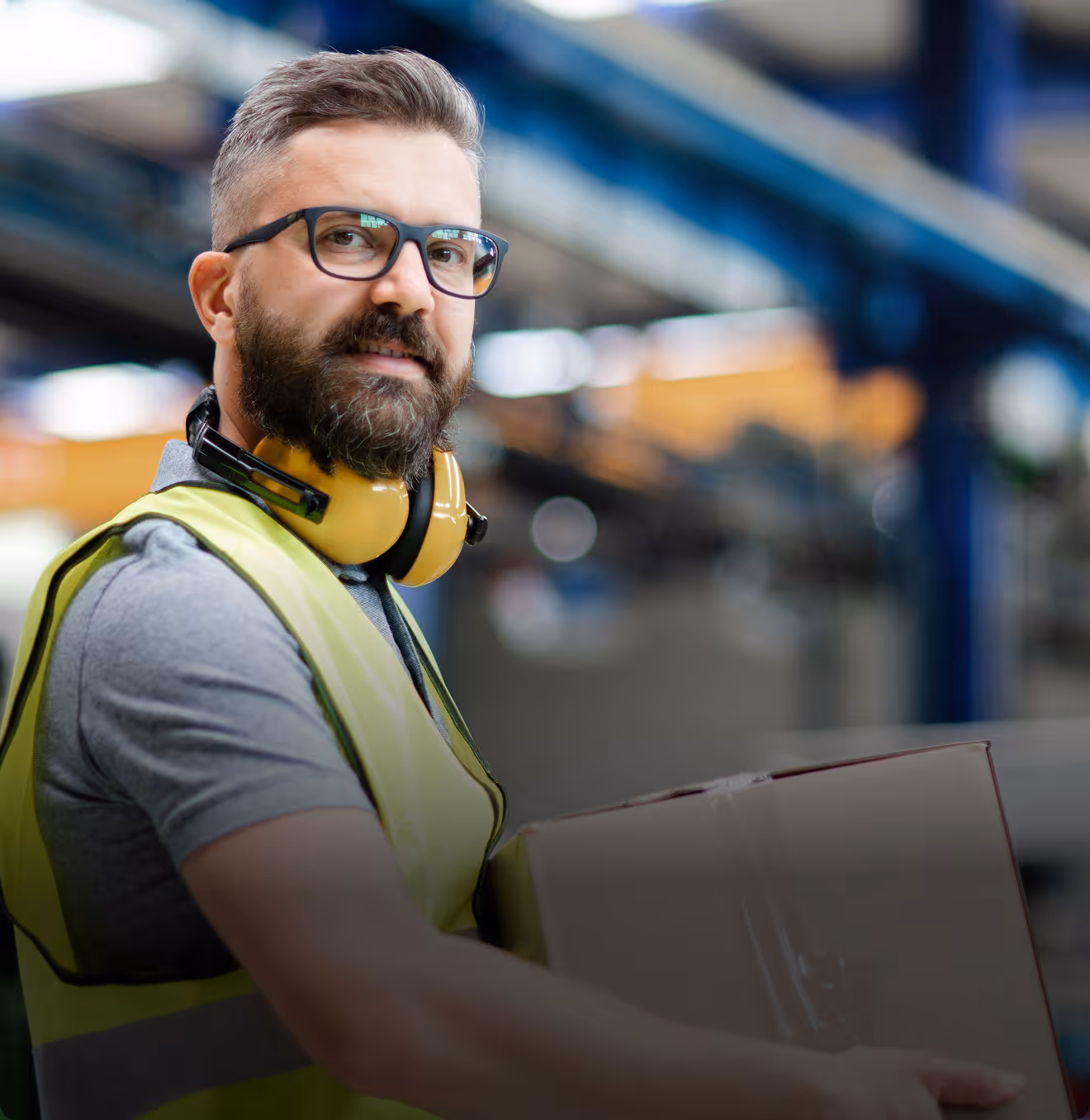Man smiling with yellow safety vest