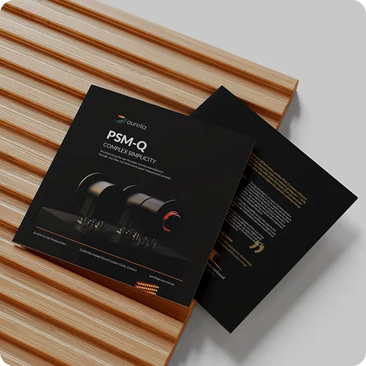 Black brochure on brown table