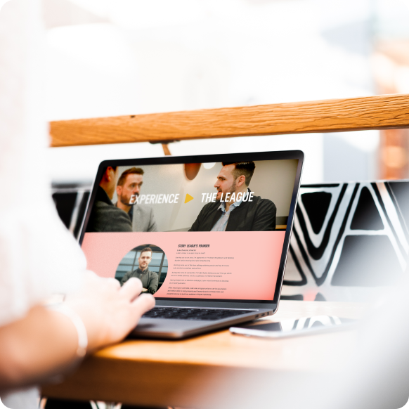 Designer editing layout on laptop