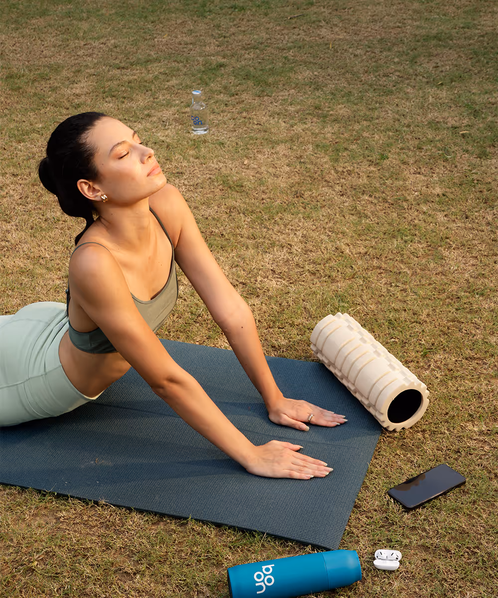 A lady stretching on a yoga mat