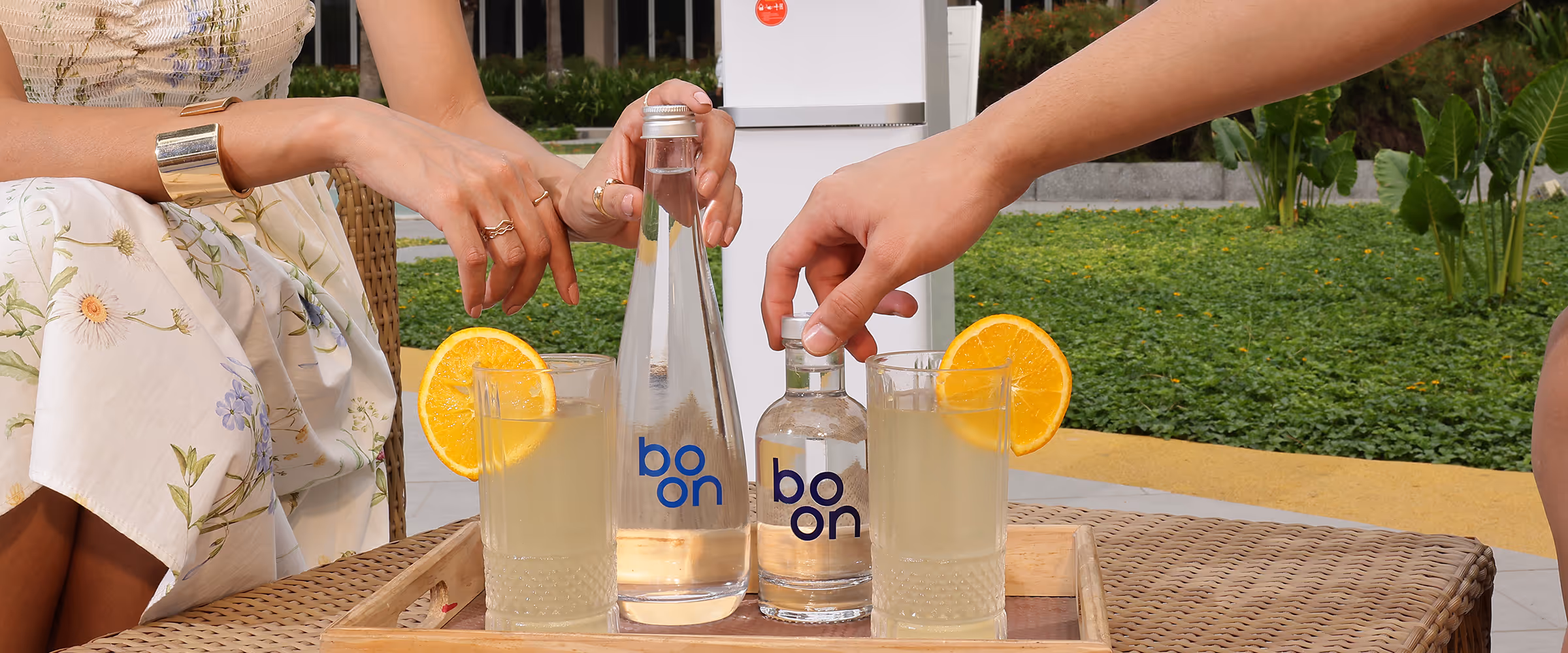 boon water bottles and cocktails on a table
