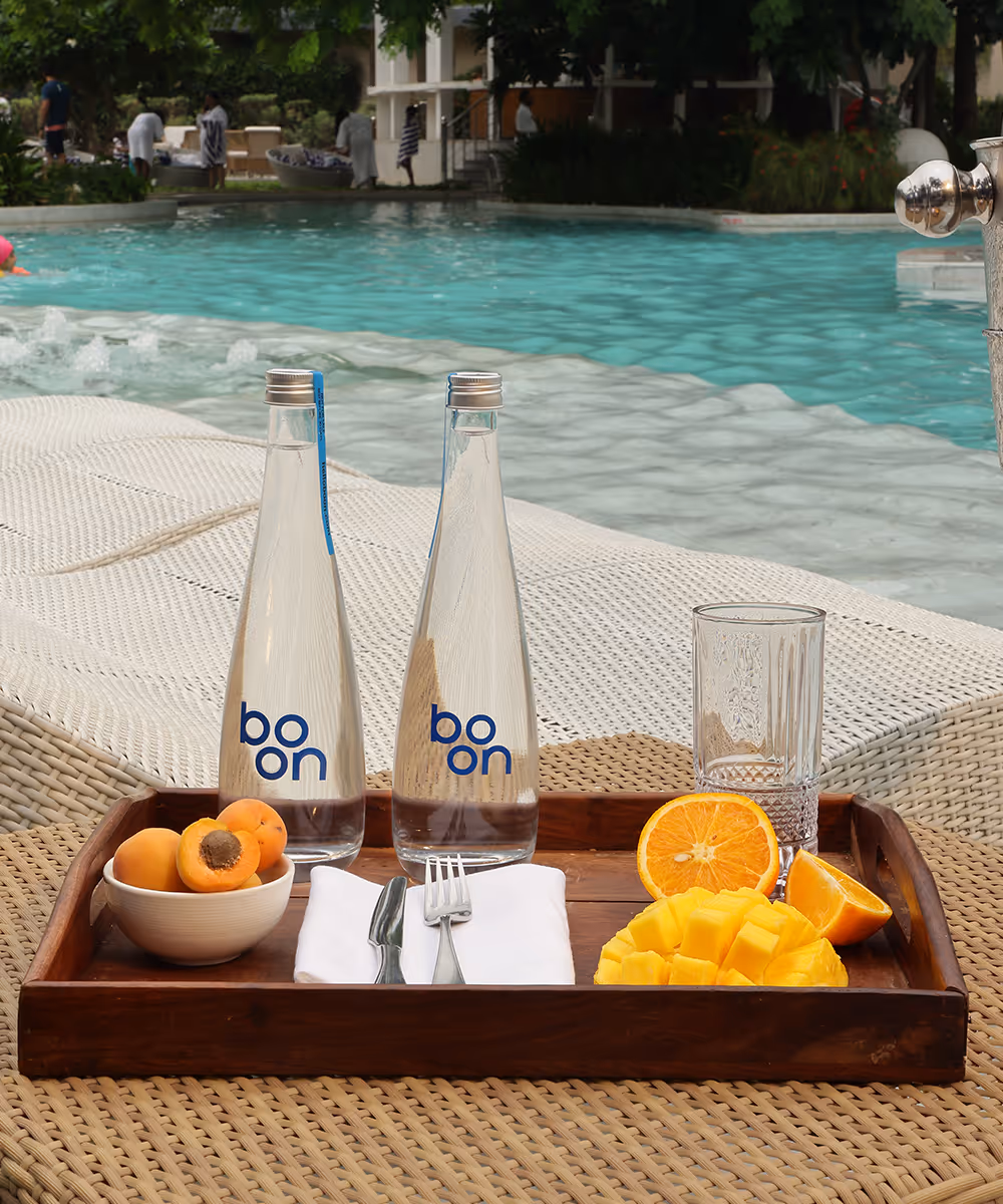 boon water bottles and cocktails on a table