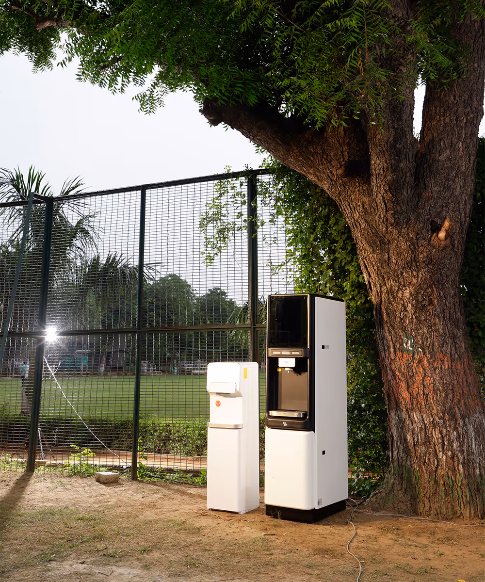 Two boon purifiers beside a tree