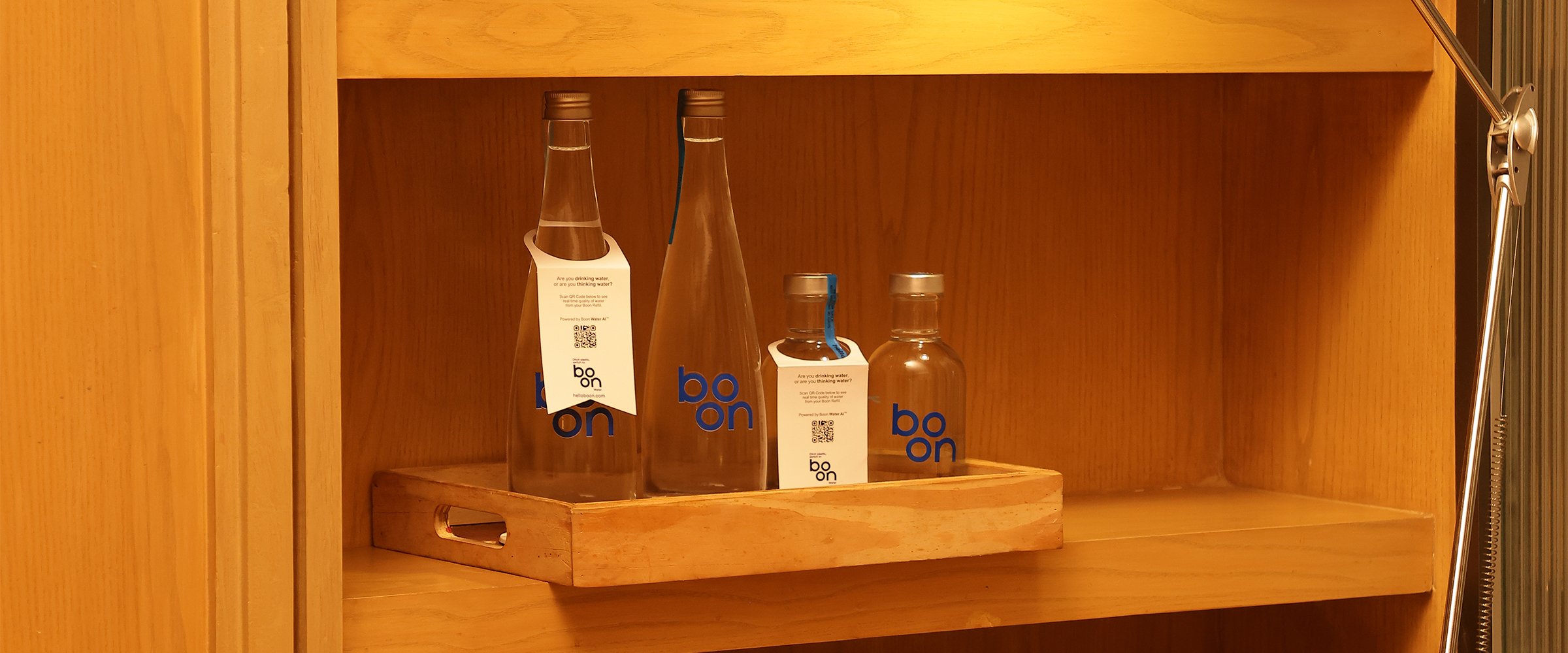 Boon water bottles in a hotel room drawer