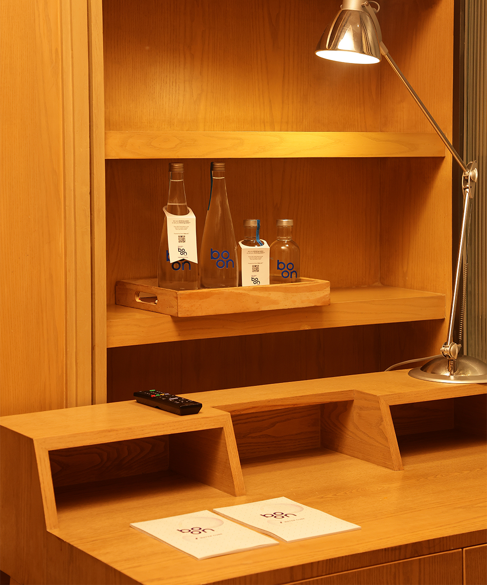 Boon water bottles in a hotel room drawer