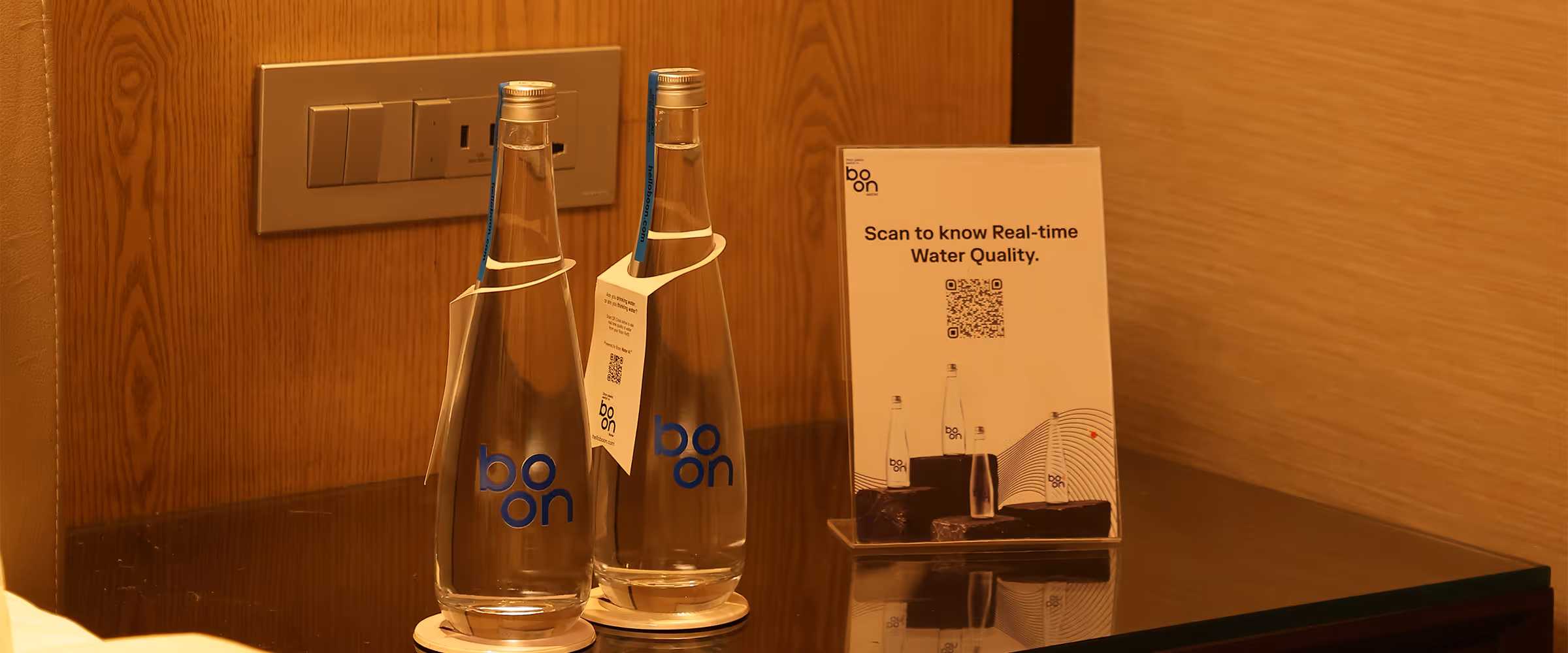Boon bottles in a hotel room desk