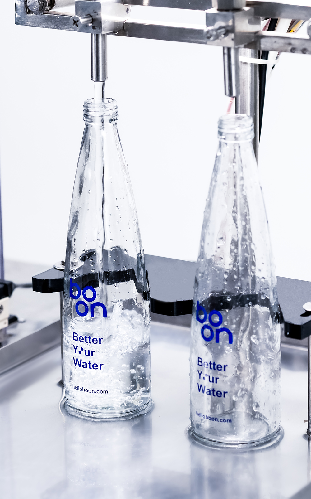 Boon water bottles in a nozzling machine