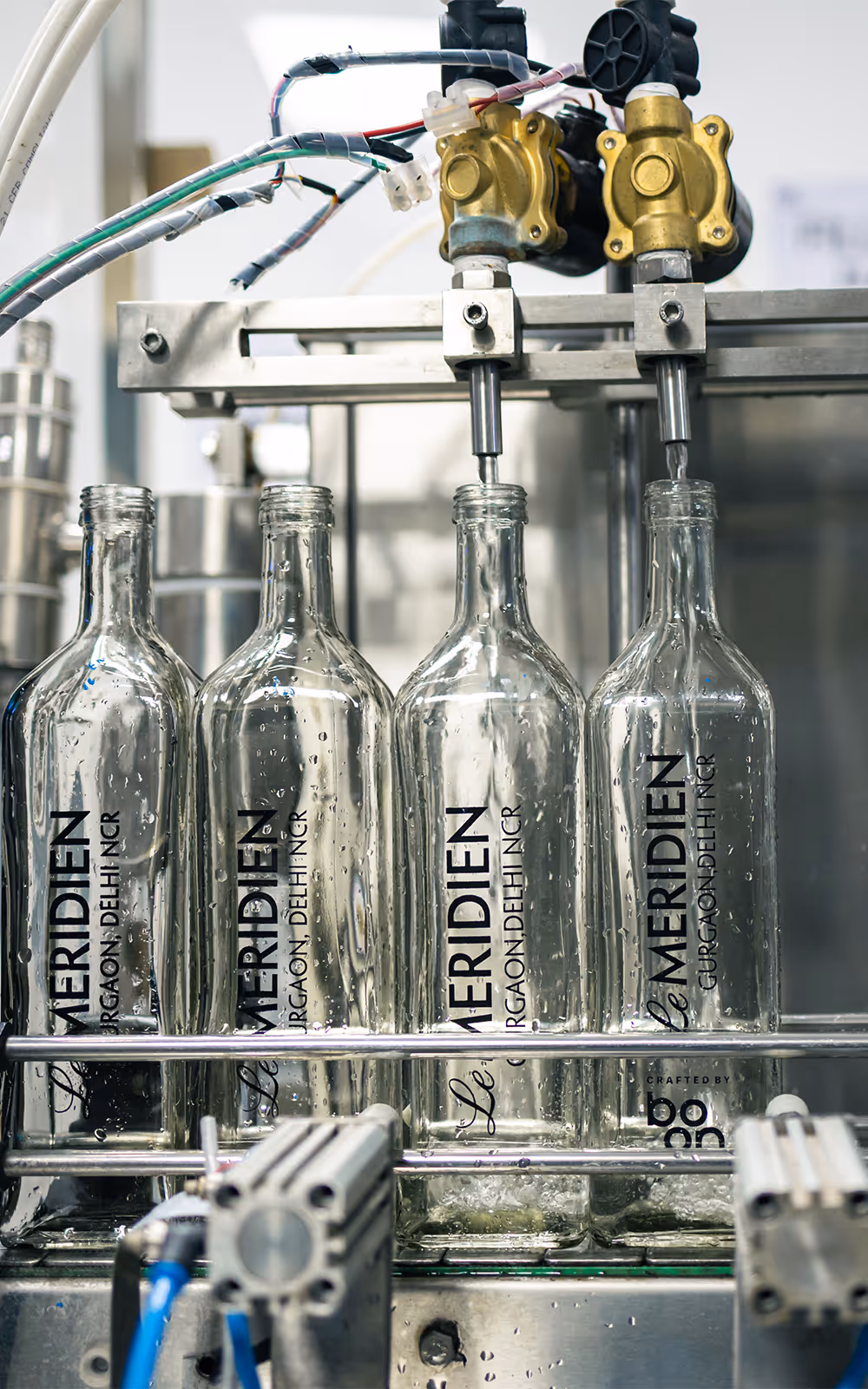 Machine pouring water into bottles
