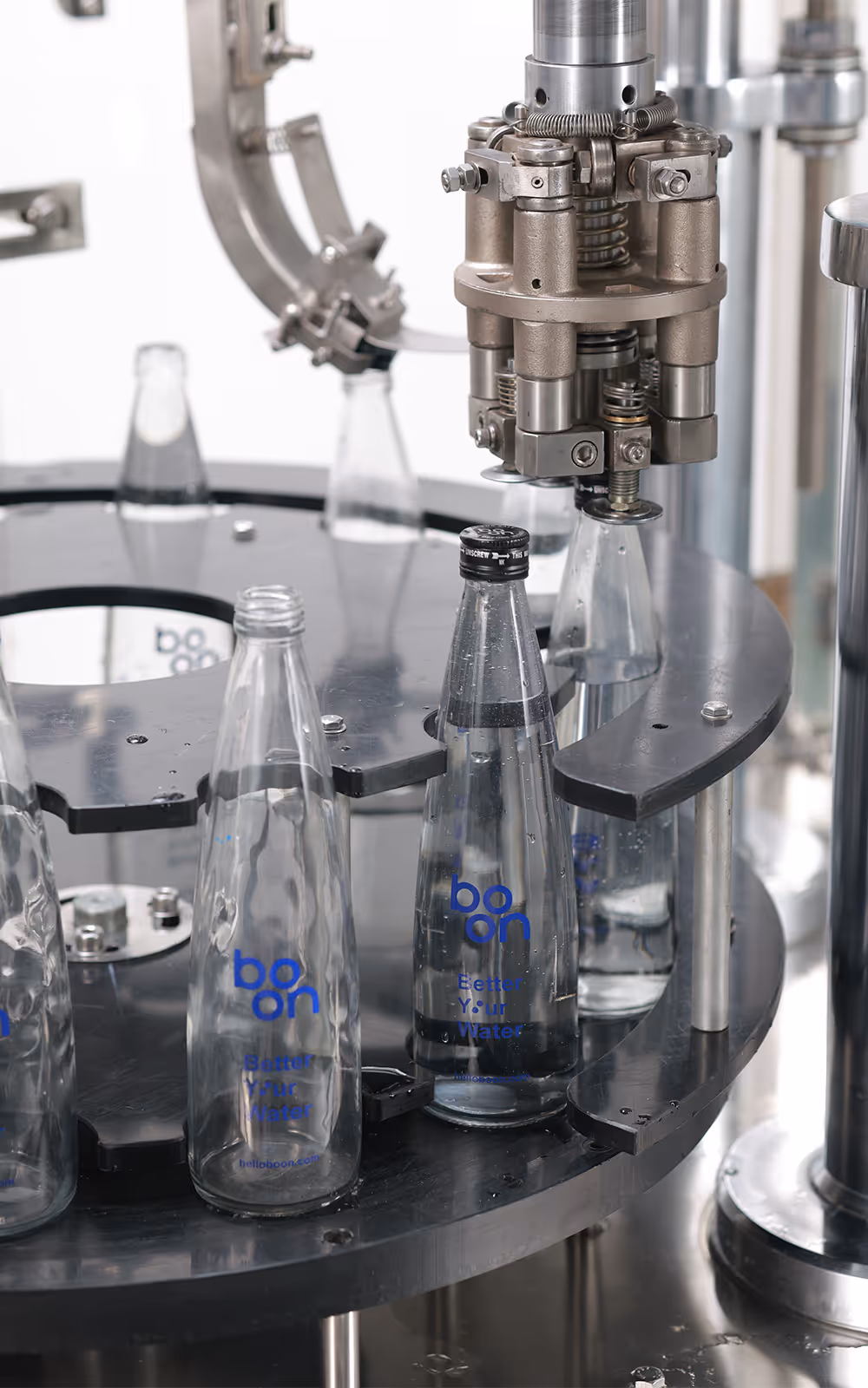 Boon bottles in a capping machine