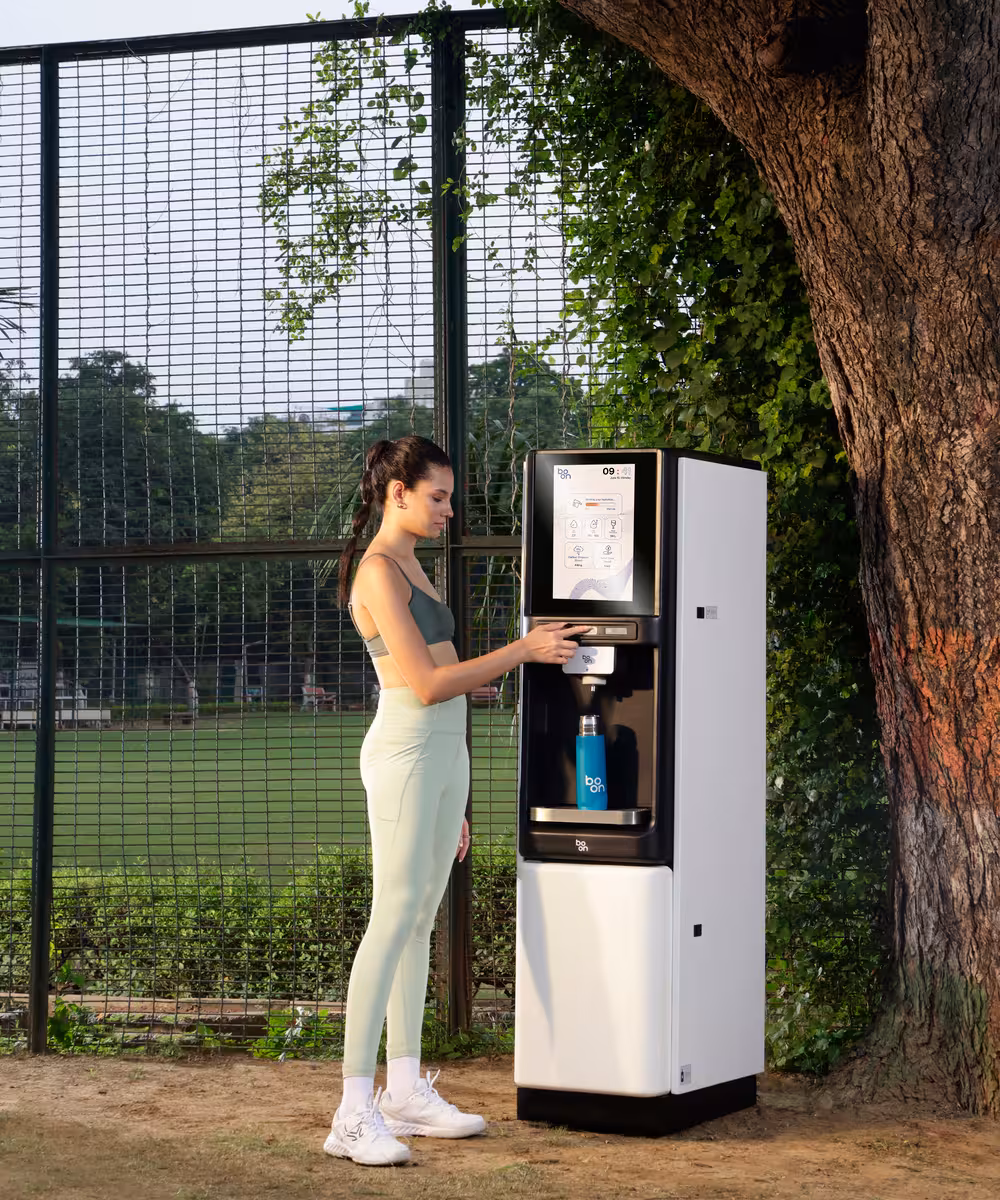 Boon water purifier beside a tennis court