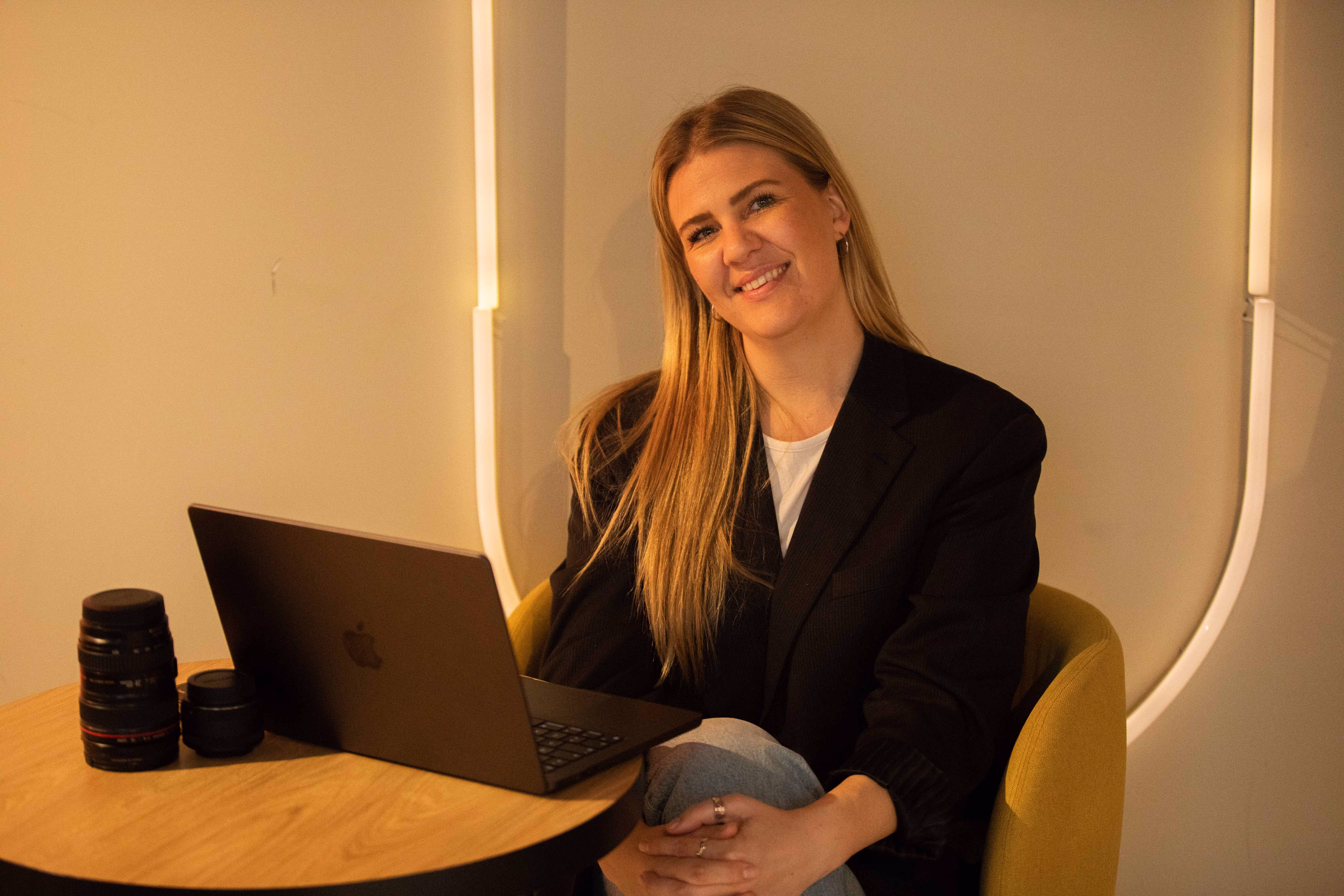 The CEO smiling, looking at the camera.