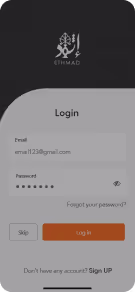 Mobile app login screen with fields for email and password, options to skip or log in, and a sign-up prompt.