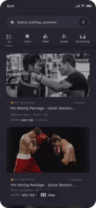 Mobile app screen showing boxing workout packages with two images of boxers training and fighting.