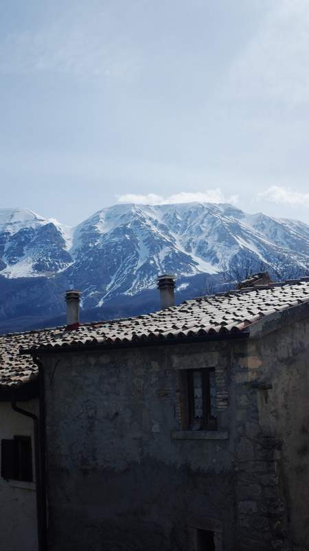 Rural village in central italy with alps in the back