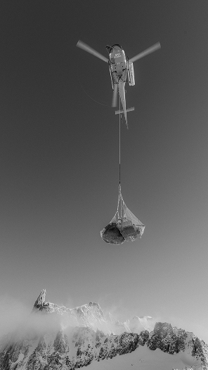 An helicopter transporting film production gear to Mont Blanc