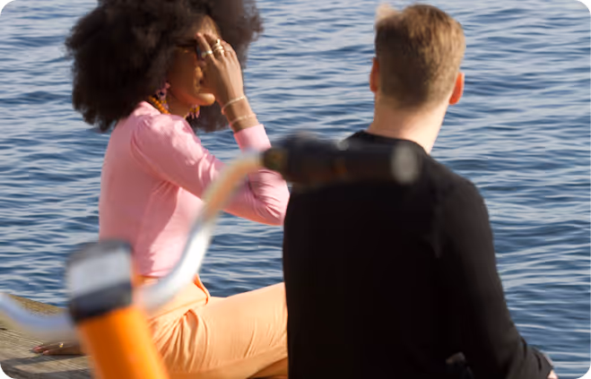 A man sitting next to a woman on a boat.