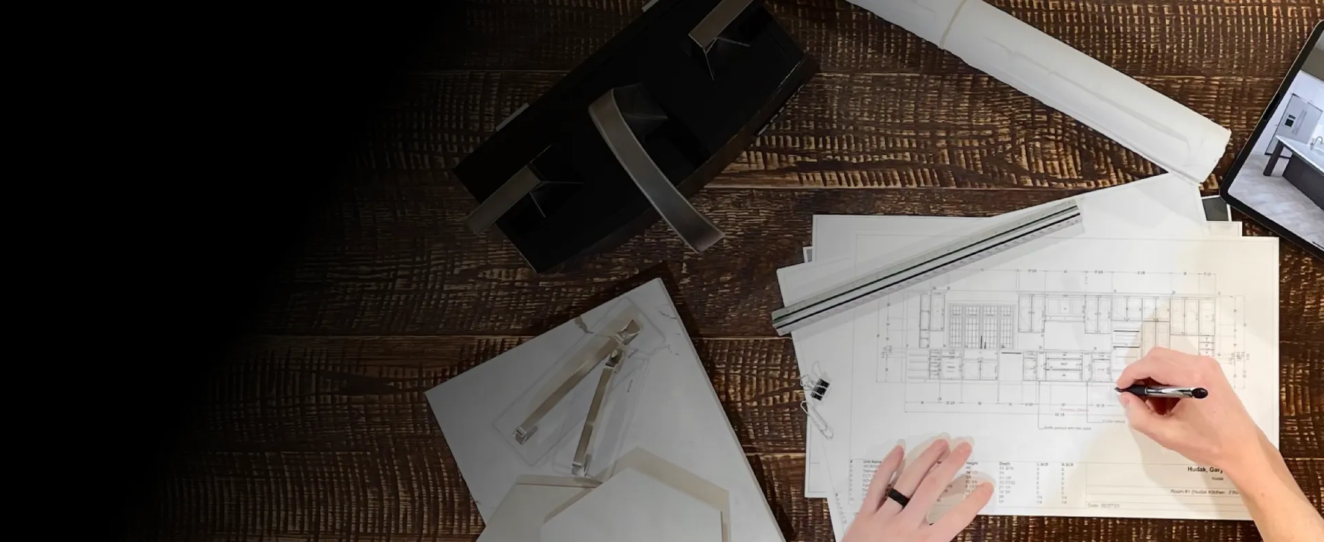 drafting table with blueprints and rulers