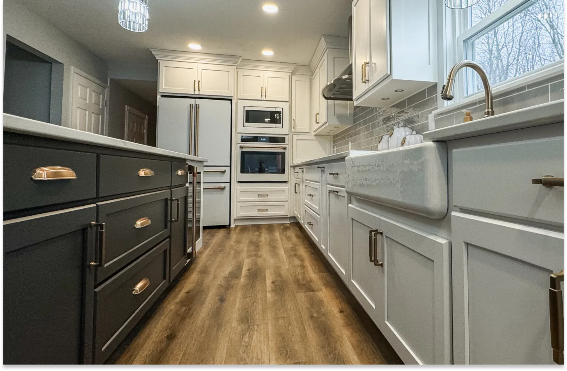 kitchen with black and gold cabinetry on the left and white and gold cabinetry on the right