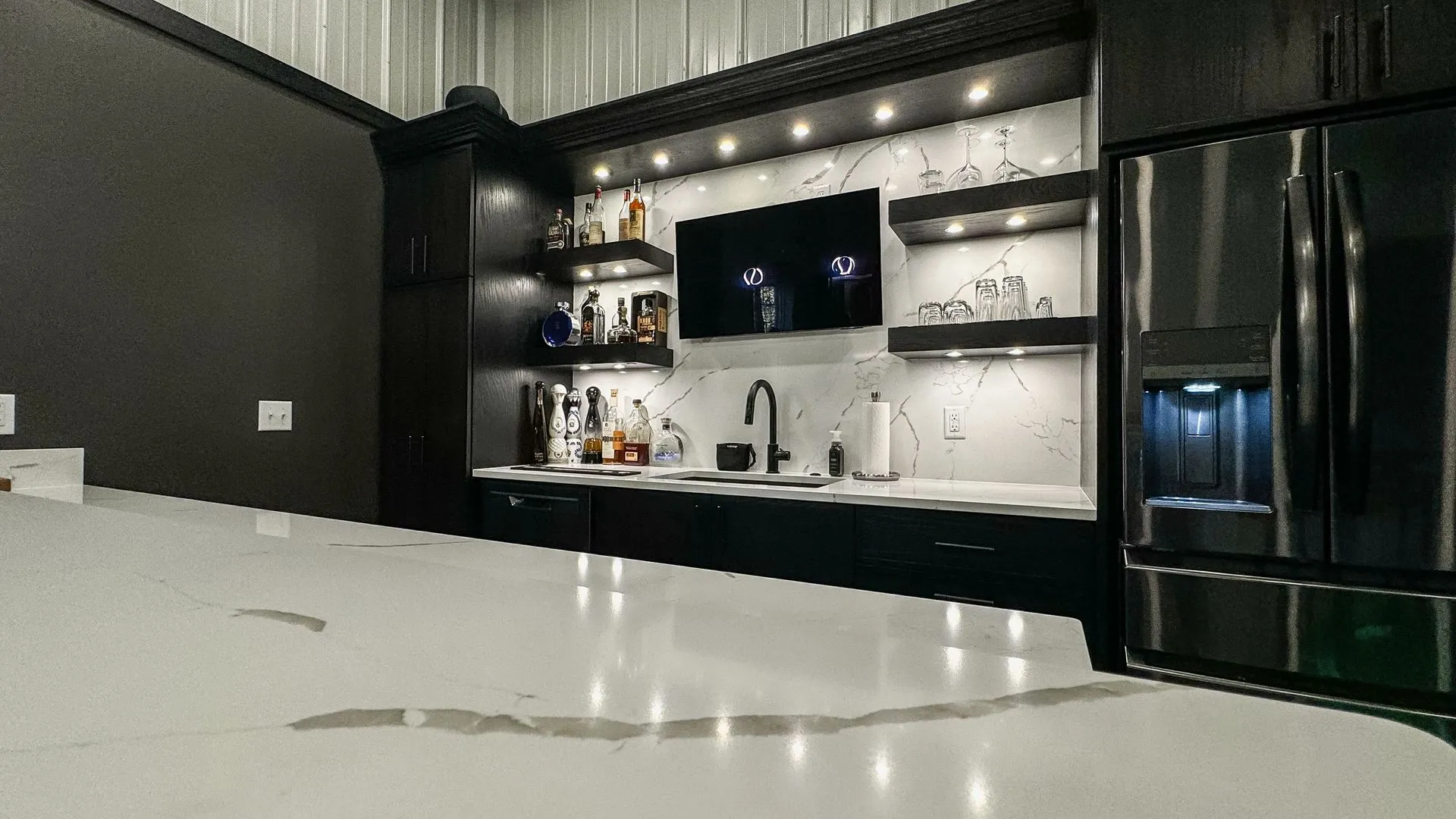 lighting under the shelving of a bar area