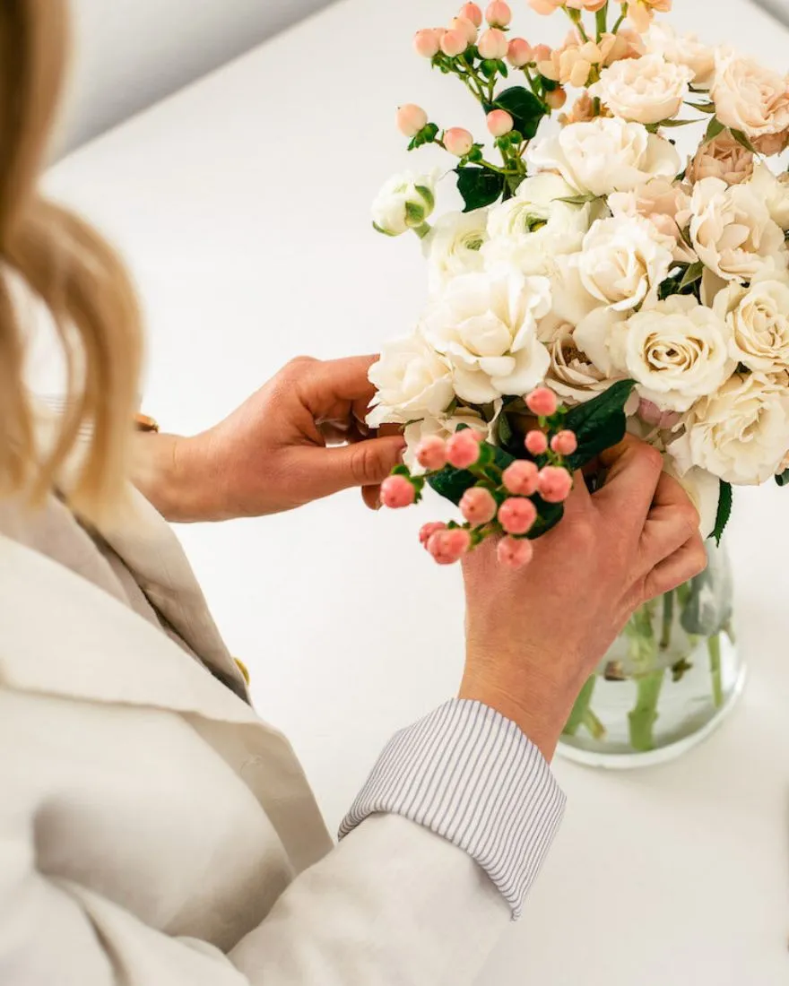 Fresh flower bouquet in a decorative vase on a table