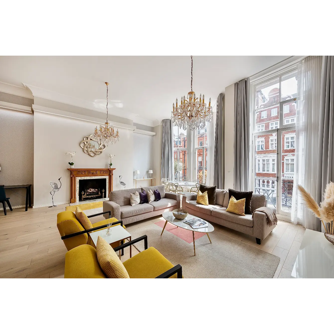 Elegant living room with yellow armchairs.