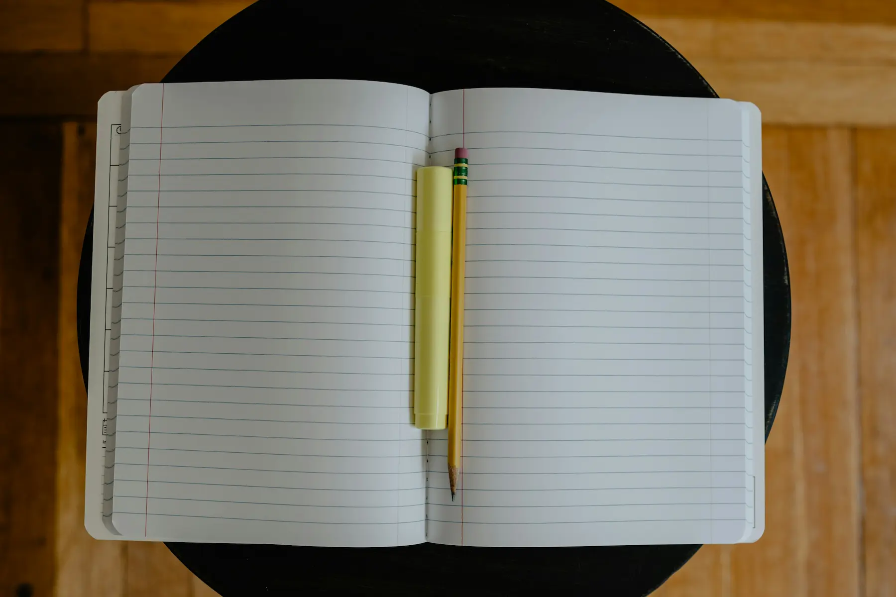 Notebook and pencil at Casa Cribs, perfect for jotting down ideas in a stylish and comfortable space.