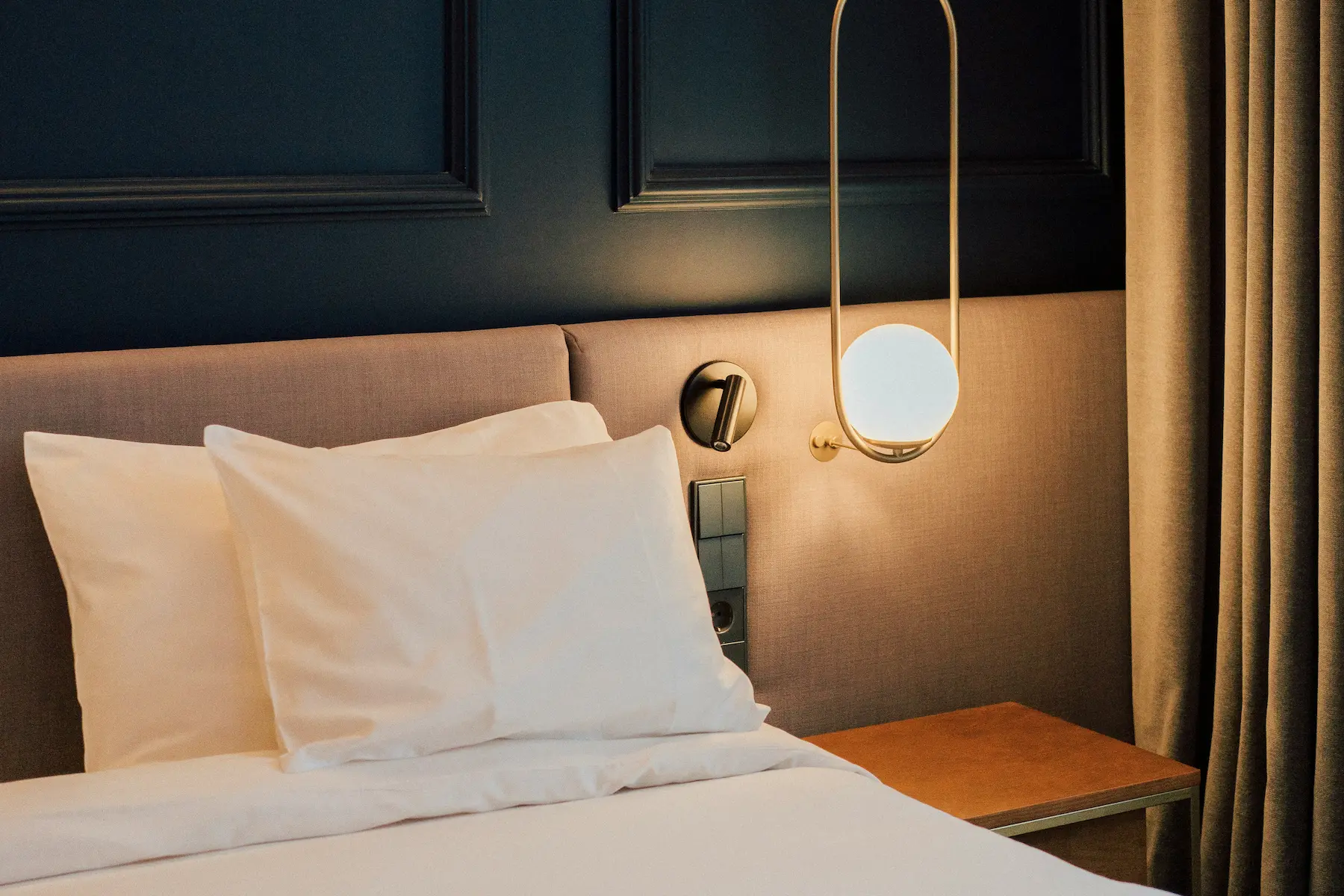 Close-up of the plush pillows on the bed at Casa Cribs showcasing comfort and refined style.
