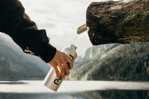 We were staying at the lake overnight. In the morning we woke up and we went to see the beautiful sunrise. Sun was peaking behind the mountains. Consequently, being both hungry and sleepy, we found this water stream and raised our bottles in happiness and satisfaction. Nothing can beat mornings in the nature. Whatever they take.