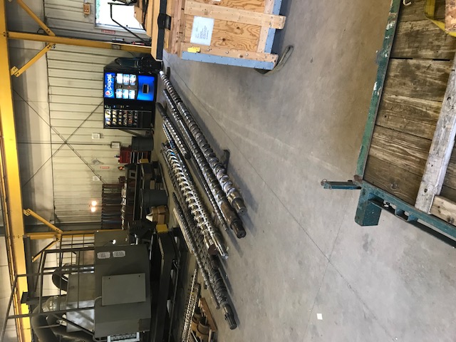 feed screws in production facility on ground