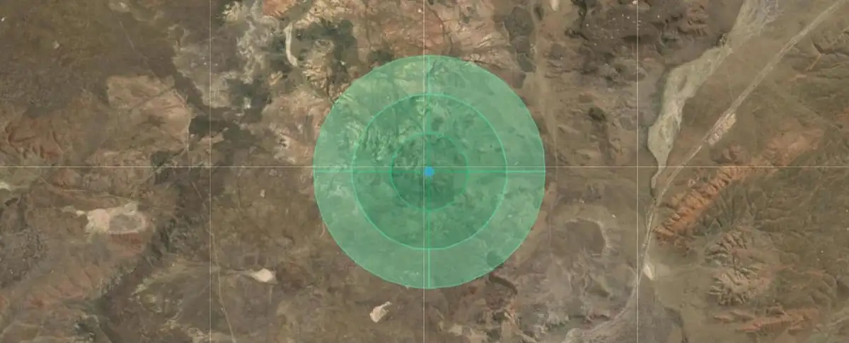 Captura de Land Planning: círculos de planeación de 3 anillos y 4 sectores alrededor de una aguada central, sobre imagen satelital del área de ejemplo Maquinchao (octubre 2026)