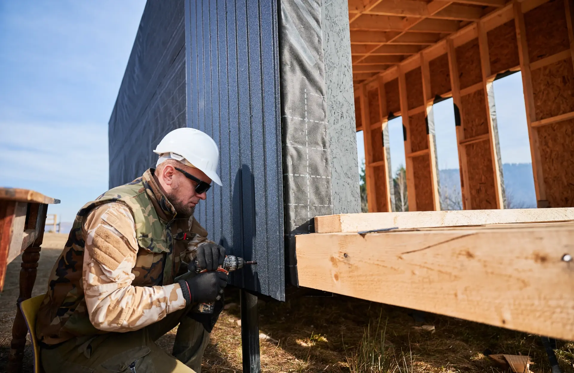 siding repair with worker making repairs