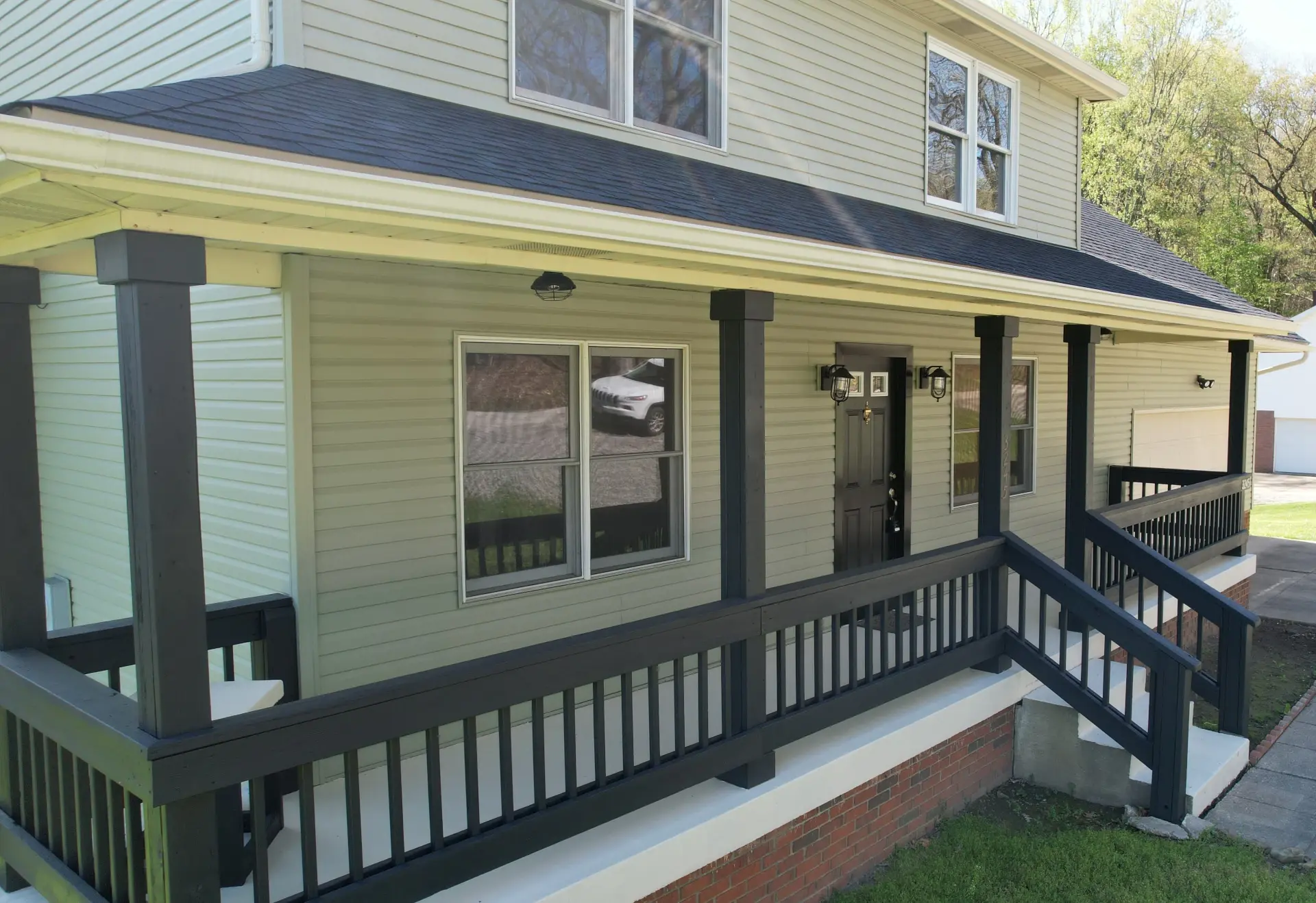 home with covered front porch with vinyl siding