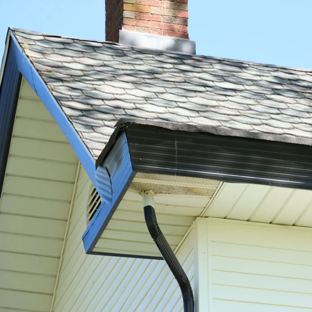 gutter on side of roof with downspout