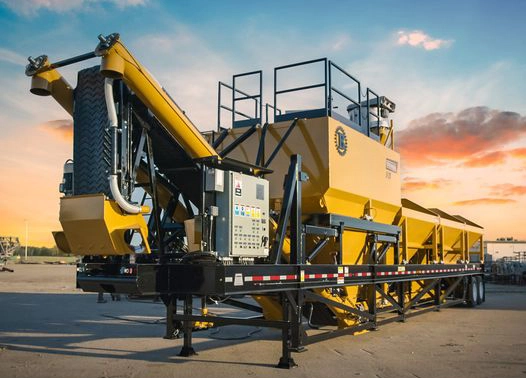 Bohringer portable processing plant with conveyors and control panel photographed at sunset, showcasing high-capacity aggregate equipment ready for operation.