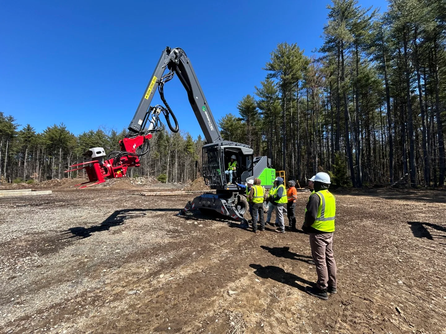 Green-Tec forestry and material handling equipment positioned on a jobsite, designed for efficient tree care and timber processing.