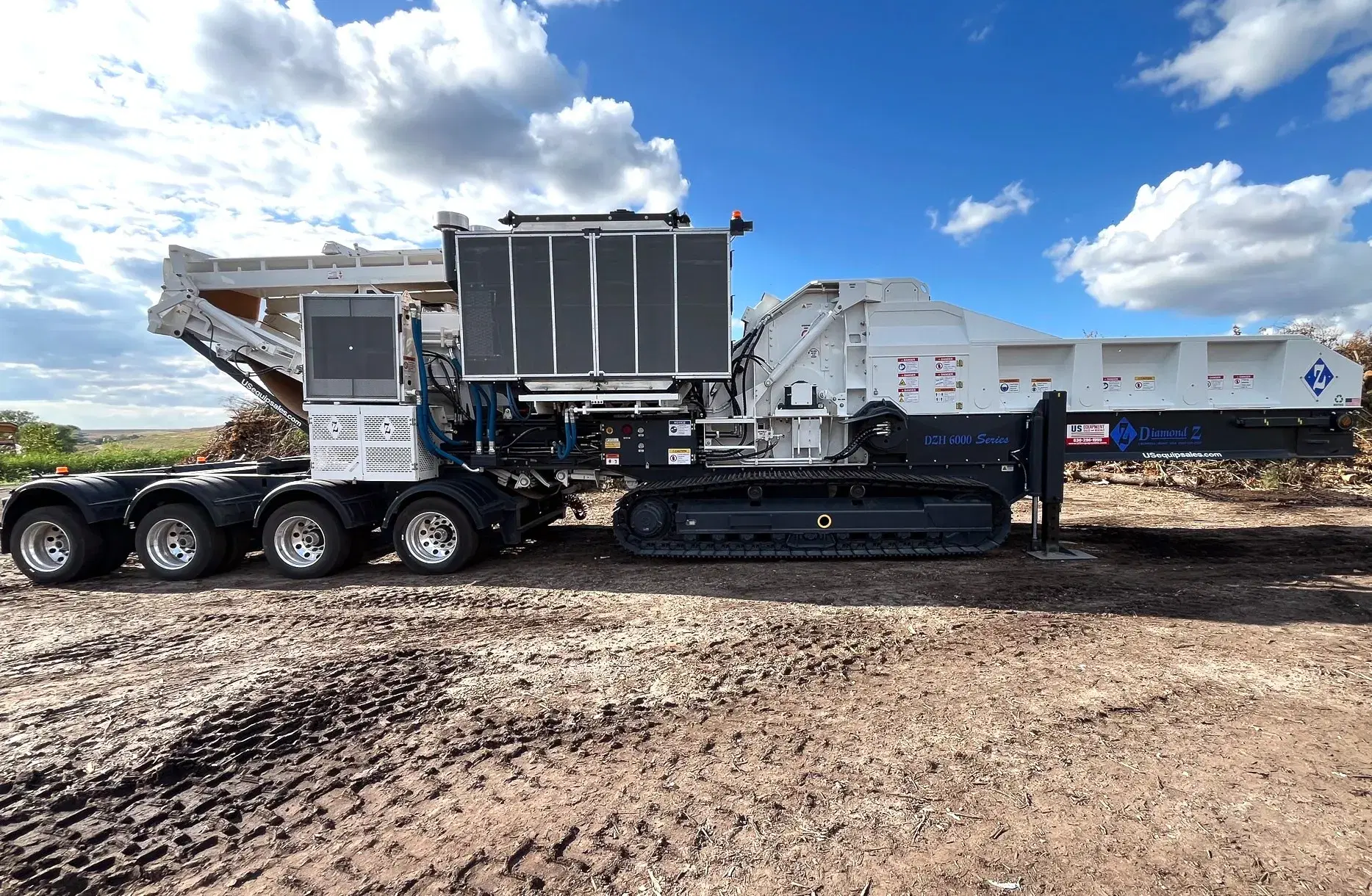 Diamond Z DZH 6000 Series horizontal grinder on tracks, designed for high-production wood waste and land clearing applications.